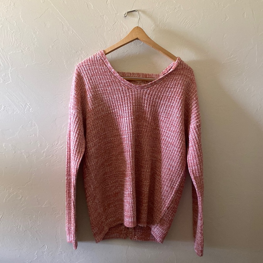 Pink/salmon sweater with criss-cross detail on back
